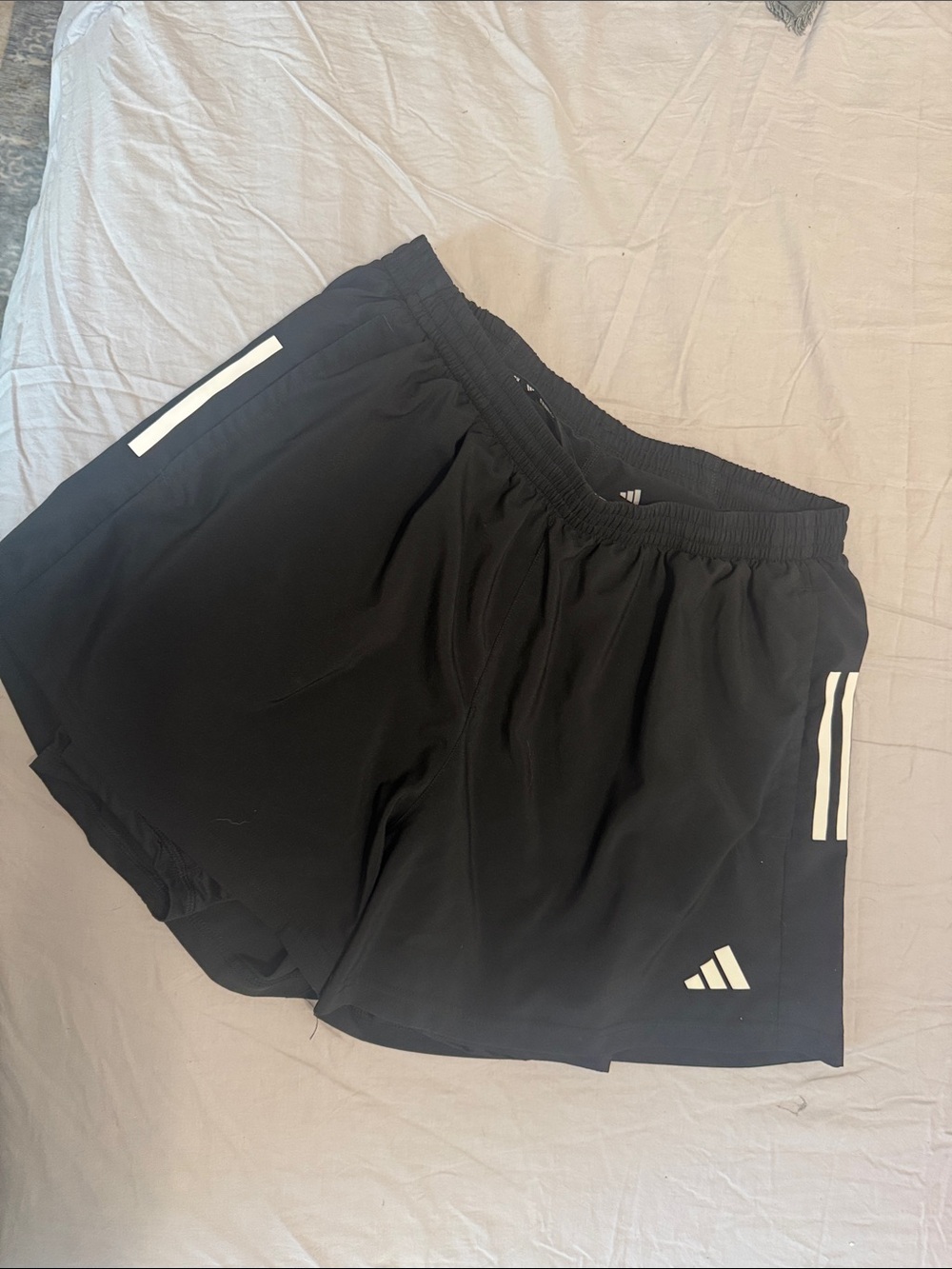 Black Adidas Men's Running Shorts with Reflective Trim and built-in compression